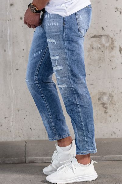 Men's light blue jeans with broken ripped stone washed fabric