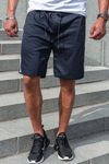 Dark blue shorts with side stripes and zippered pockets