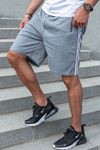 Gray shorts with side stripes and zippered pockets