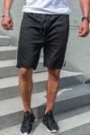 Black shorts with side stripes and zip pockets