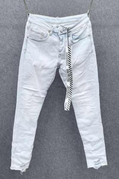 Light blue jeans with a subtle distressed finish L32 Light blue jeans with a subtle distressed finish L32